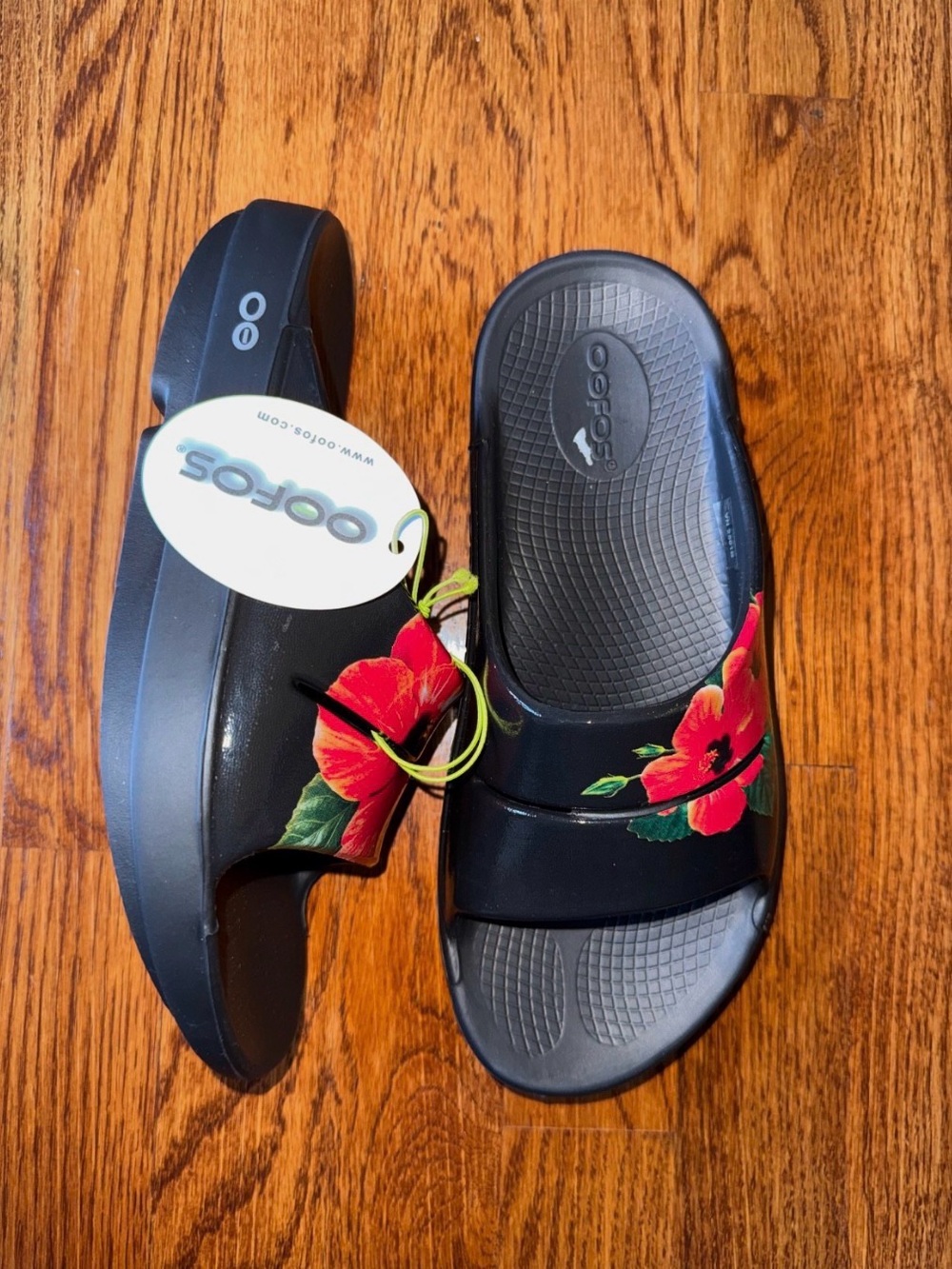 OOFOS Ooahh Hibiscus Black Slide Sandals with Red Floral Accent
